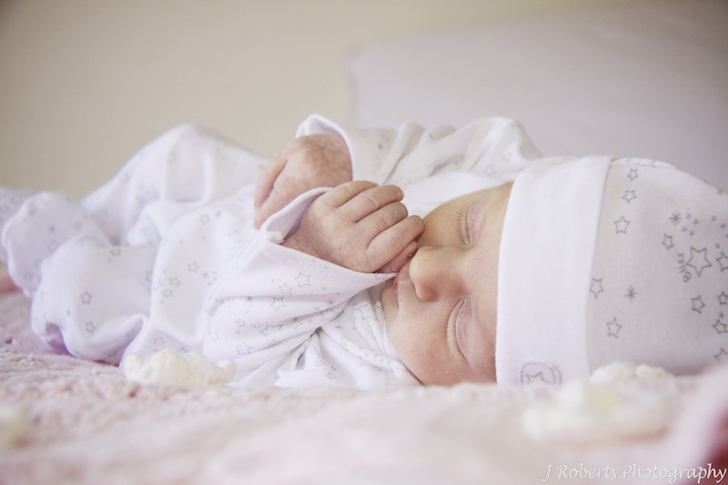Baby sleeping on crocheted rug - newborn baby photography sydney